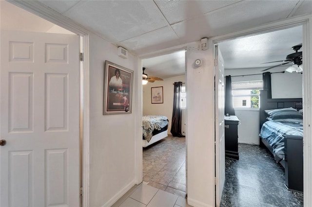 hallway featuring light tile patterned floors