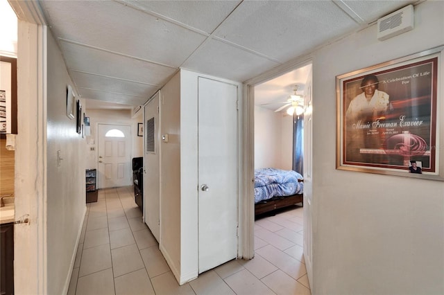 hallway with light tile patterned floors