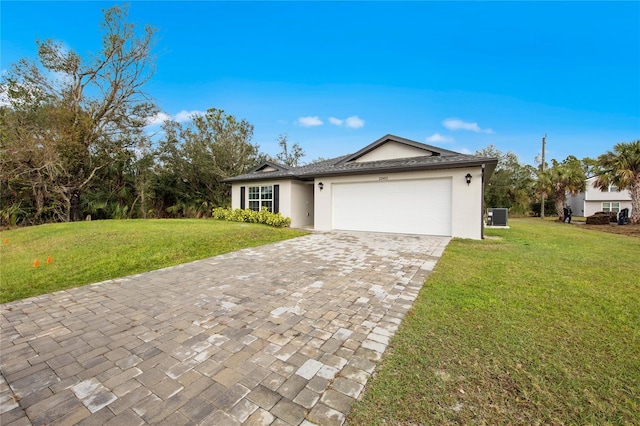 ranch-style home featuring a garage and a front lawn