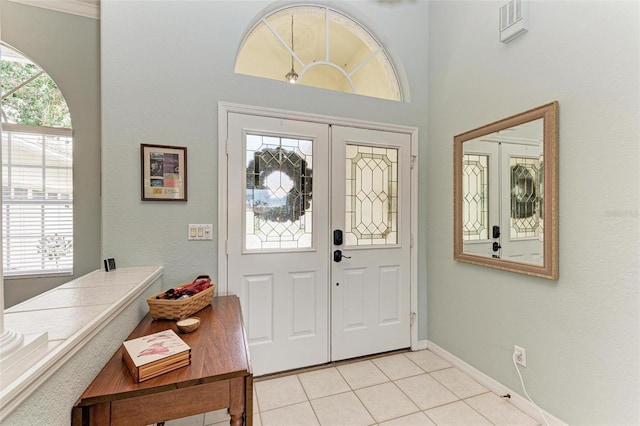 entrance foyer with french doors and light tile patterned floors