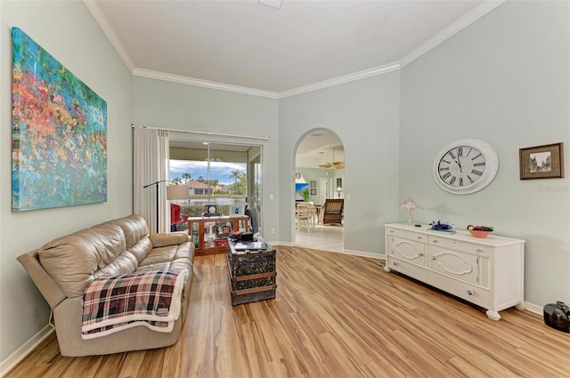 living room with hardwood / wood-style floors and ornamental molding