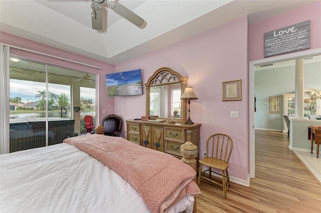 bedroom featuring ceiling fan, access to outside, and light hardwood / wood-style flooring