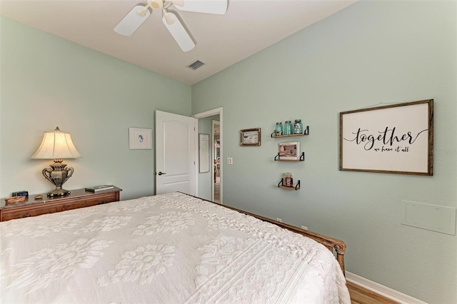 bedroom with ceiling fan and wood-type flooring