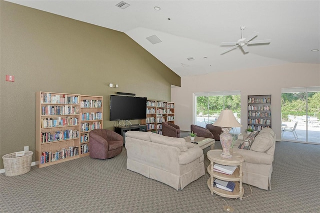 carpeted living room with lofted ceiling and ceiling fan