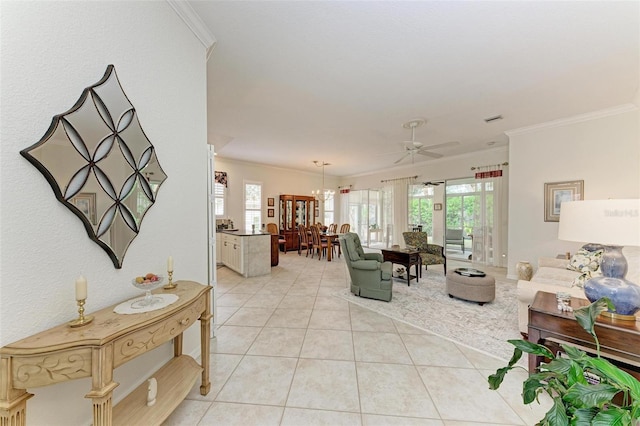 living room featuring ceiling fan, crown molding, and plenty of natural light