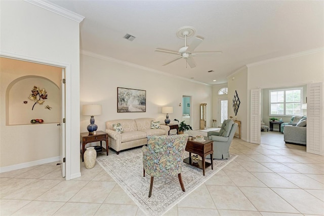 living room with ornamental molding and light tile patterned floors