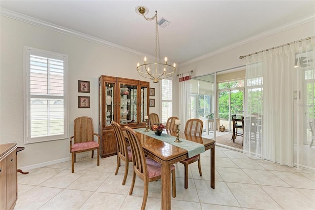 tiled dining space featuring a chandelier, a wealth of natural light, and ornamental molding