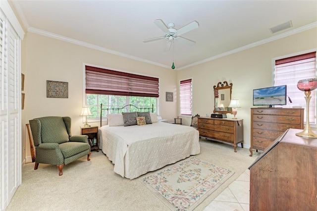 tiled bedroom featuring ceiling fan and crown molding