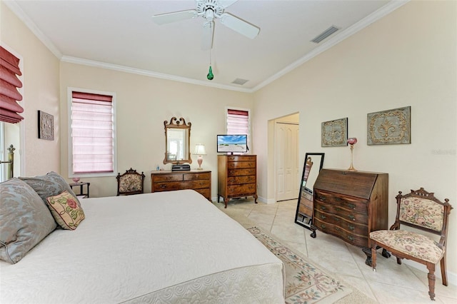 bedroom featuring ornamental molding, light tile patterned flooring, ceiling fan, and a closet