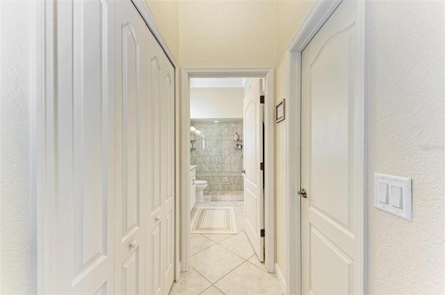 corridor featuring light tile patterned flooring