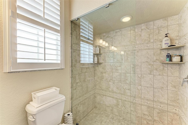 bathroom with a tile shower