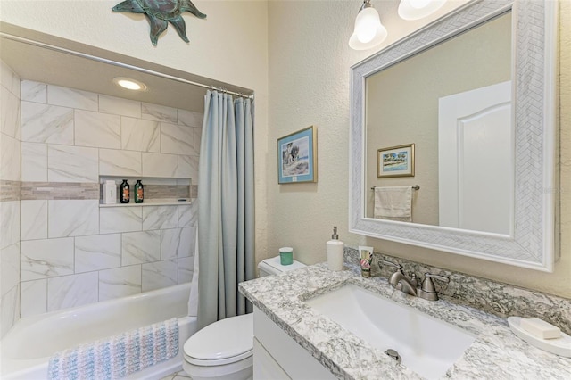 full bathroom featuring toilet, shower / tub combo, and vanity