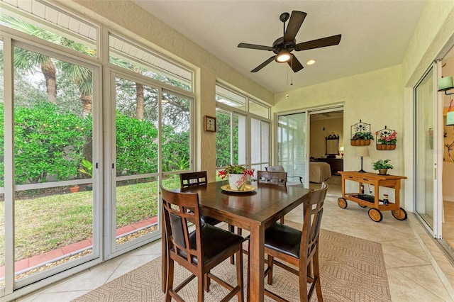 sunroom featuring ceiling fan