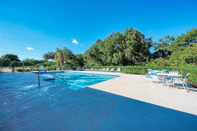 view of swimming pool with a patio area