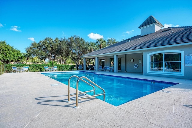 view of pool featuring a patio