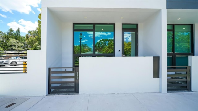 doorway to property with stucco siding