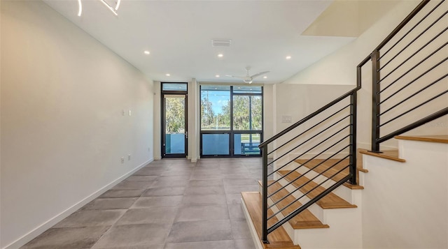 interior space with visible vents, expansive windows, baseboards, and recessed lighting