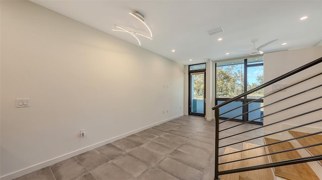 unfurnished room featuring recessed lighting, visible vents, a ceiling fan, baseboards, and stairway