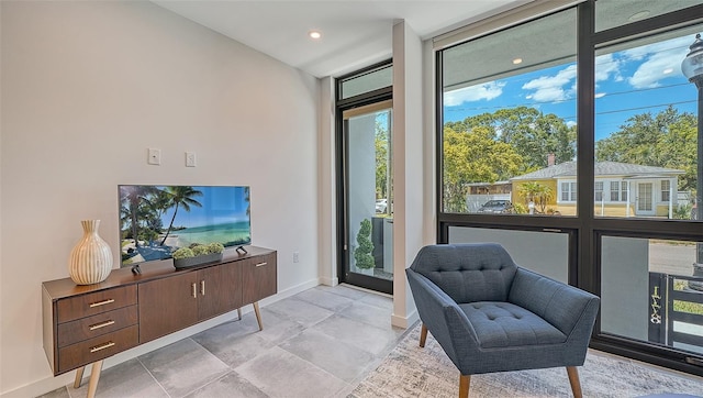 living area with a wall of windows