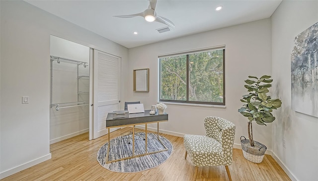 office space featuring ceiling fan and hardwood / wood-style flooring