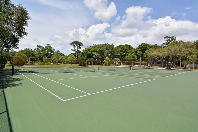 view of tennis court featuring basketball court