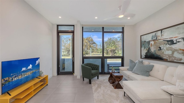 tiled living room with a wall of windows and recessed lighting