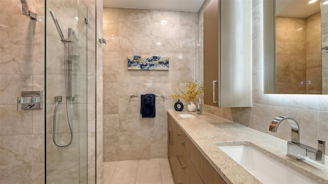 bathroom featuring a sink, tile walls, and a walk in shower