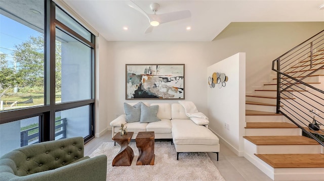 living room featuring light tile patterned floors, stairway, recessed lighting, and baseboards