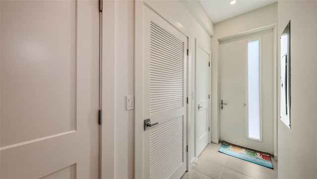 entryway featuring light tile patterned floors and recessed lighting