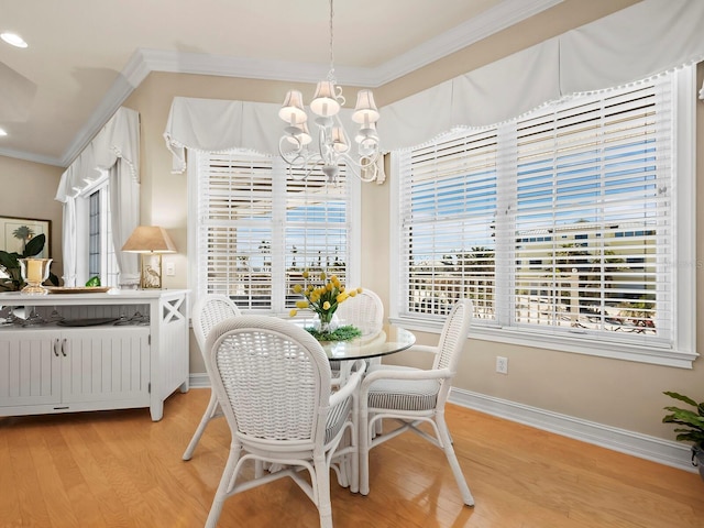 dining area featuring a notable chandelier, light hardwood / wood-style flooring, ornamental molding, and radiator