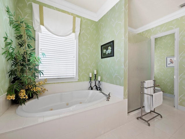 bathroom featuring tile patterned flooring and tiled tub