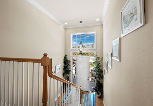 stairway featuring hardwood / wood-style flooring and ornamental molding