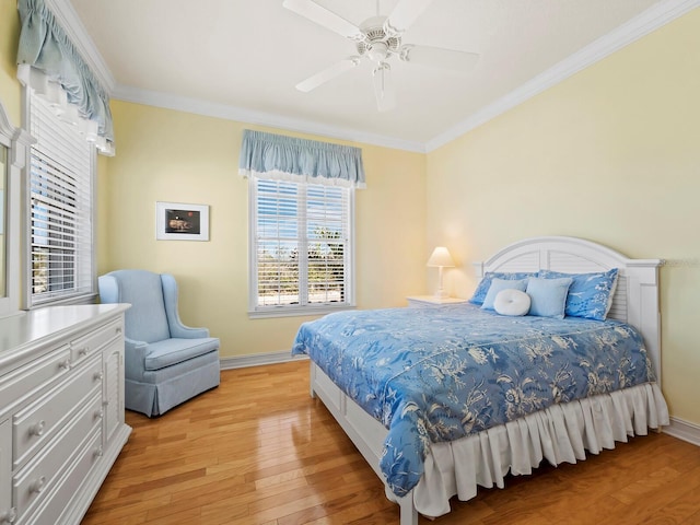 bedroom with crown molding, ceiling fan, and light wood-type flooring