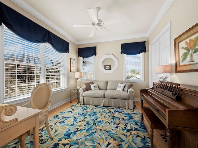 living room with ceiling fan, ornamental molding, hardwood / wood-style floors, and plenty of natural light