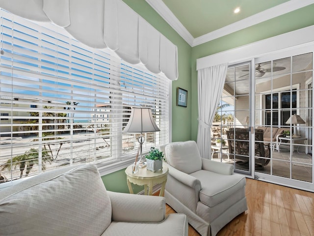 sitting room featuring crown molding and wood-type flooring