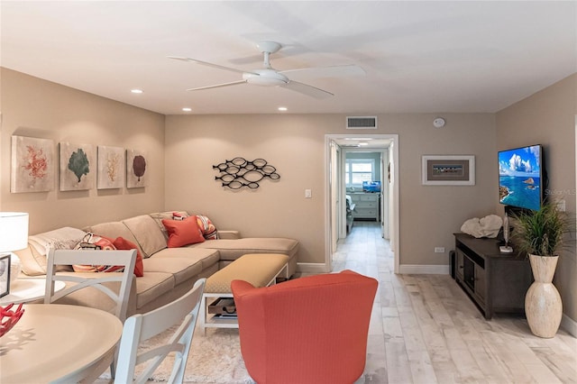145 Avenida Messina Unit 3, Sarasota, FL 34242 - living room with ceiling fan and light wood-type flooring