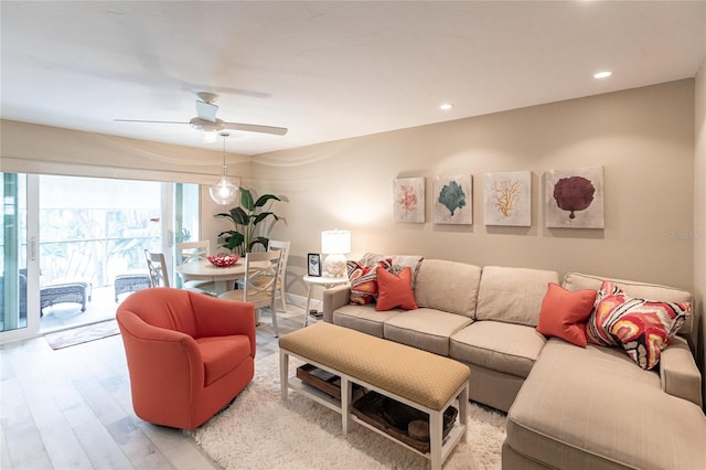 145 Avenida Messina Unit 3, Sarasota, FL 34242 - living room with ceiling fan and light wood-type flooring