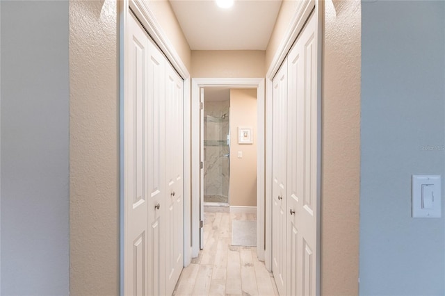 145 Avenida Messina Unit 3, Sarasota, FL 34242 - corridor featuring light hardwood / wood-style floors