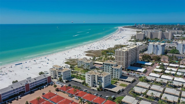 bird's eye view featuring a beach view and a water view