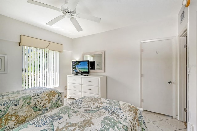 bedroom featuring ceiling fan and light tile patterned floors