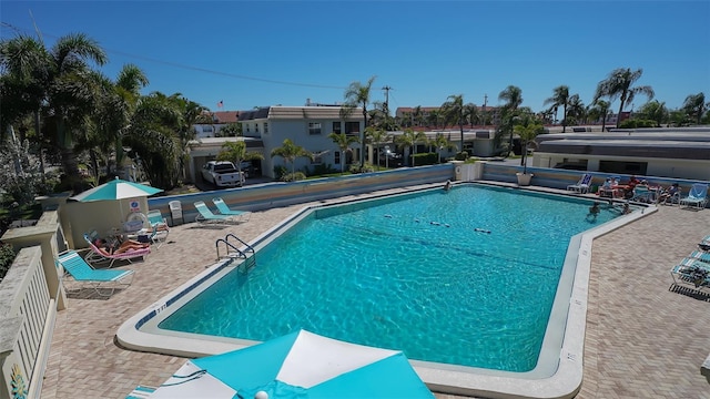 view of swimming pool featuring a patio area