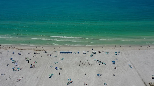 bird's eye view with a beach view and a water view