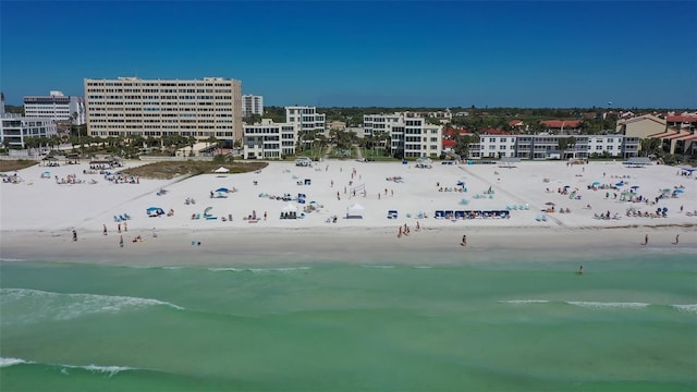 aerial view with a water view and a view of the beach