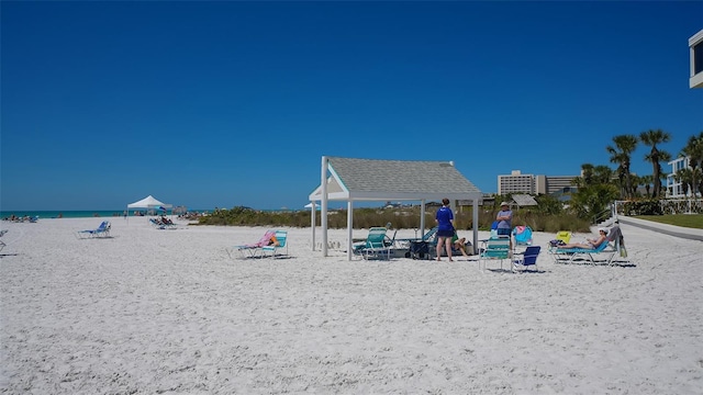 exterior space featuring a gazebo and a water view