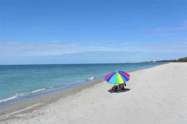 property view of water featuring a beach view