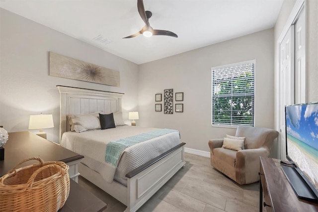 bedroom with a closet, ceiling fan, and light wood-type flooring