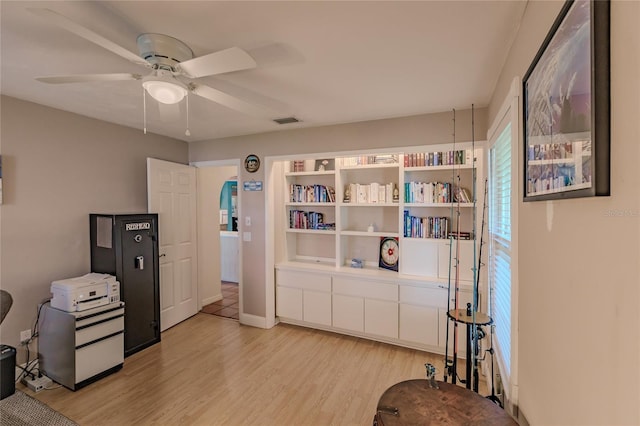 miscellaneous room featuring ceiling fan and light hardwood / wood-style flooring