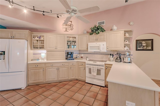 kitchen with tasteful backsplash, ceiling fan, kitchen peninsula, white appliances, and light tile patterned floors