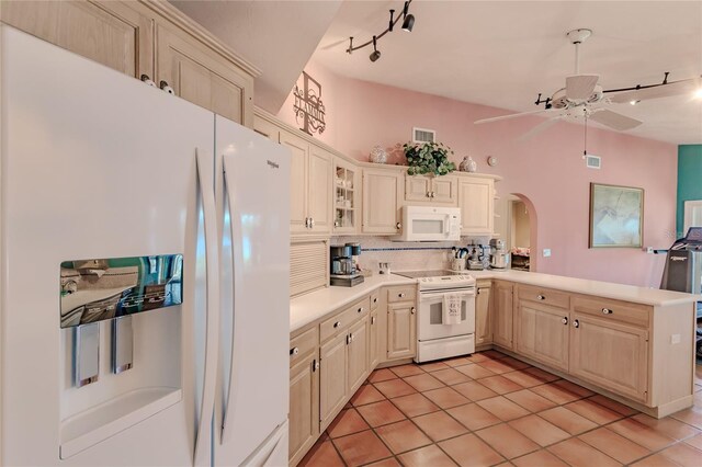 kitchen with ceiling fan, kitchen peninsula, decorative backsplash, light tile patterned flooring, and white appliances