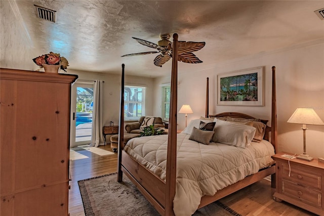 bedroom featuring ceiling fan, access to outside, and light wood-type flooring